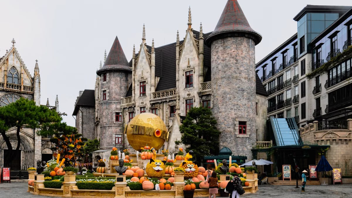 Charming castle with festive pumpkins at Ba Na Hills, Da Nang, Vietnam, perfect for a magical travel experience.